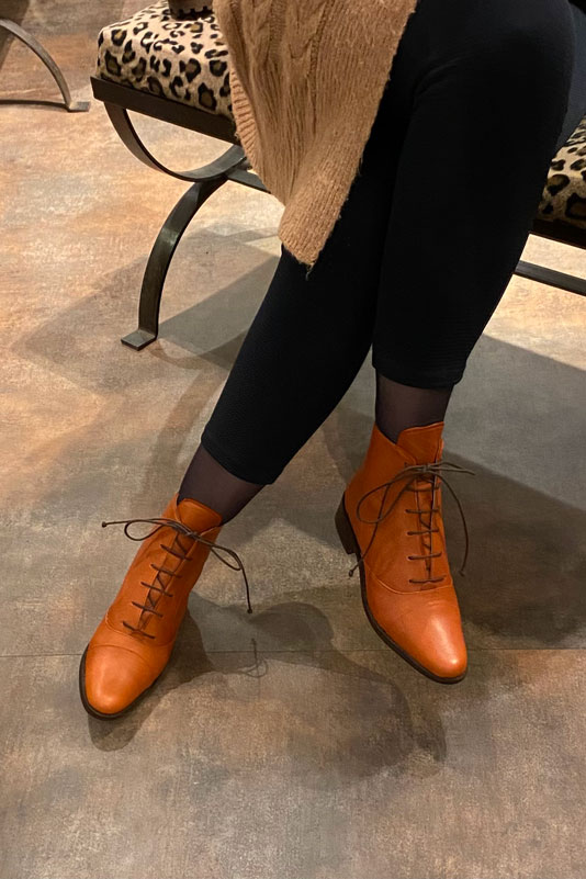 Terracotta orange women's ankle boots with laces at the front. Round toe. Flat leather soles. Worn view - Florence KOOIJMAN